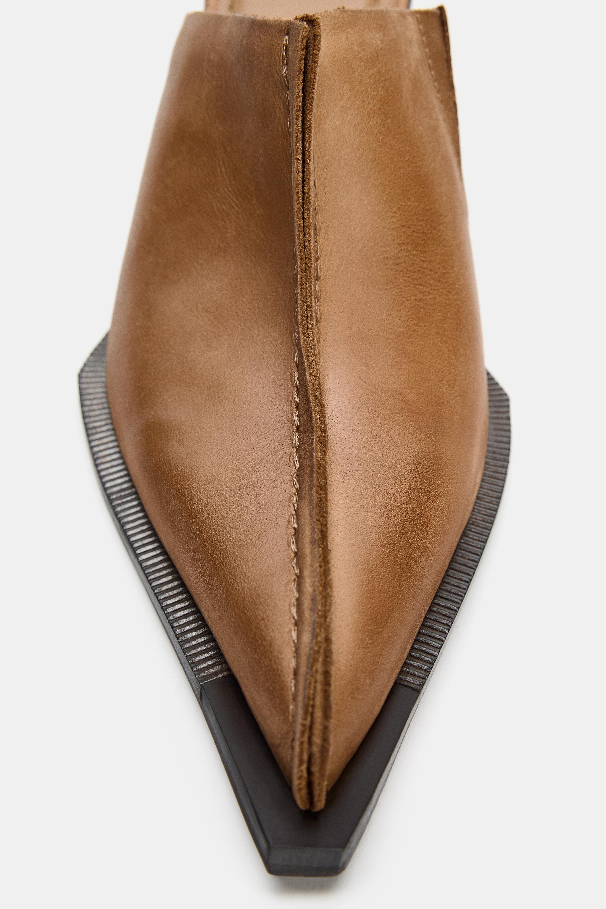 SABOTS EN CUIR AVEC SURPIQÛRE